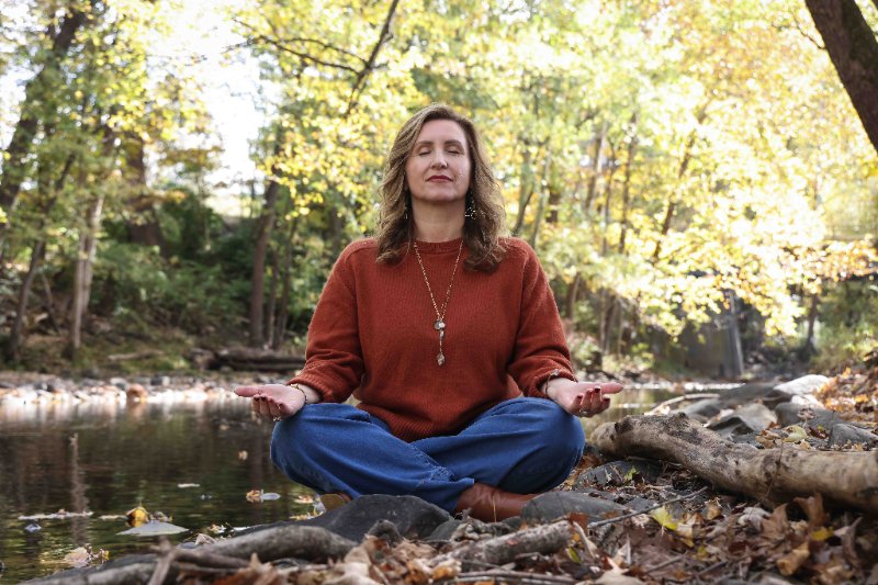 Christine Dorsey outdoors during an intuitive energy healing session